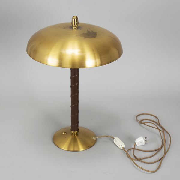 Einar Bäckström : Brass and Leather Table Light. A model 5013 brass dome table light with stem wrapped in leather. 1940's.