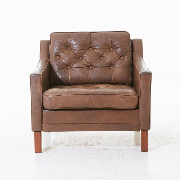 Ib Kofod Laresen :  Leather Armchair, 1960s with cushioned seats and teak legs. Sweden.