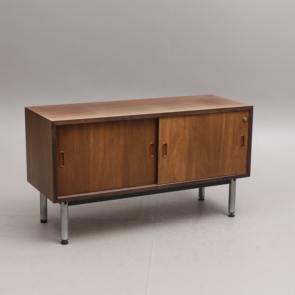 Document Cabinet in Walnut on chromed steel legs and with lock. Mid-20th century. 