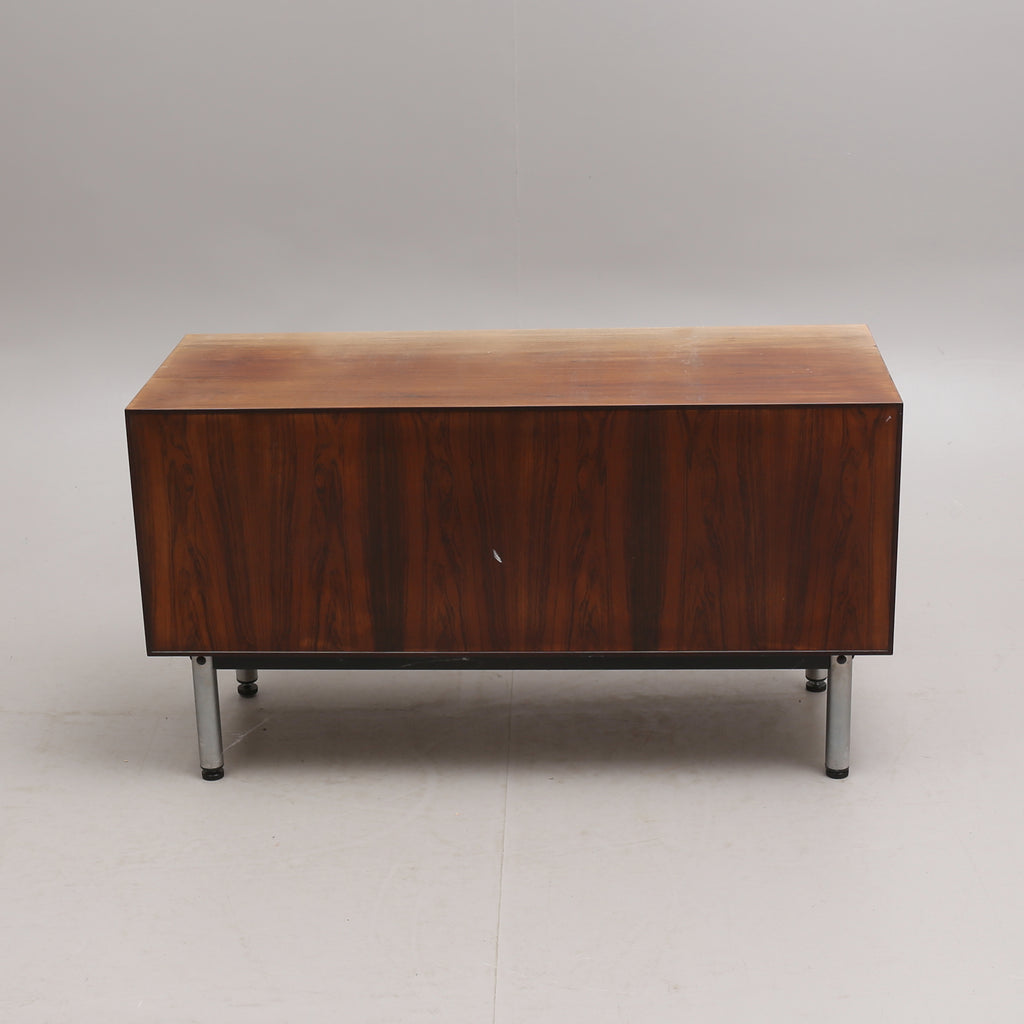 Document Cabinet in Walnut on chromed steel legs and with lock. Mid-20th century.